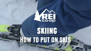 How to Put on Skis  REI [upl. by Eiramanin]