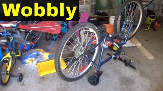 How To Straighten A Wobbly Bicycle WheelTutorial [upl. by Grearson697]